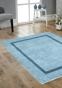 Bespoke light blue oblong rug on a wooden effect floor.