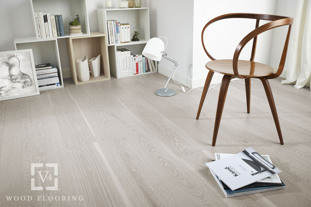 Light coloured V4 Alpine Lock laminate flooring in a contemporary style room with a stylish wooden chair.