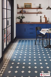 Blue and white Karndean Heritage flooring in a rustic style kitchen featuring large wooden French doors.