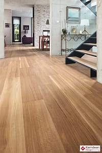 Mixed tan coloured Karndean Looselay Lemon Spotted Gum flooring in a modern style residential hallway.