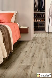 Moduleo Mountain Oak 56215 flooring in a contemporary style bedroom with sliding wardrobes.