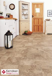 Mixed tan coloured Karndean Art Select, Guernsey Stone flooring in a rustic style kitchen.