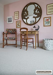 Light grey Unnatural Flooring LI8006 Long Island carpet in a traditional style room featuring a wooden table and chair set under a large round mirror.
