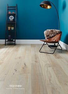 Light coloured Ted Todd Classic Crafted Textures Coombe flooring in a contemporary style room with turquoise walls.