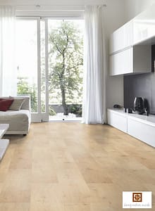 V4 Indian Summer Oak laminate flooring in a modern living space with sliding patio doors leading to a garden.
