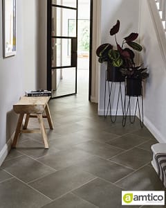 Amtico Spacia dark grey Ceramic Sable flooring with a large tiled pattern in a contemporary style entrance hall.