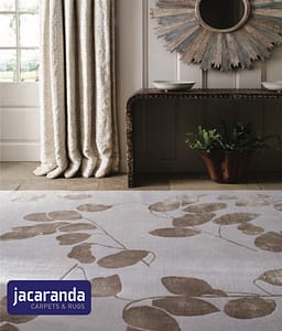 Jacaranda Moon Leaf Silver rug in a traditional style living room with floor length cream pleated curtains.
