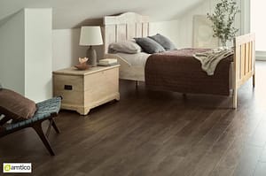 Amtico Form dark brown Bisteroak Stripwood effect flooring in a contemporary bedroom setting.