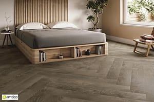 Amtico Form Kalmar Oak flooring with a herringbone pattern in a modern bedroom.