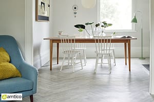 Amtico Spacia light grey herringbone wood effect flooring in a home office.