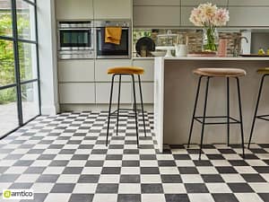 Amtico Signature black and white check flooring with a chessboard pattern in a modern kitchen.